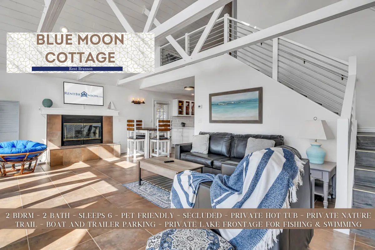 A cozy living space featuring a comfortable sofa, coffee table, television, decorative artwork, and a dining area. Large windows invite natural light and offer glimpses of the outdoors, creating a relaxing and welcoming atmosphere for guests.